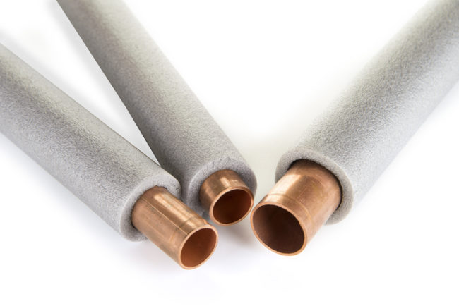 Insulation for heating pipes on a white background pipe insulation