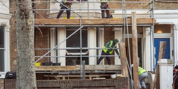 Workers on a scaffold Tender